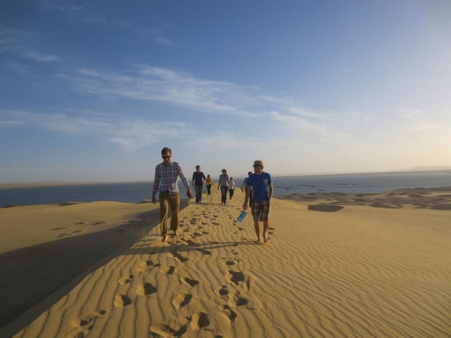 Al Fayyum, Egypt. Shannon's student group walking along the dunes. 